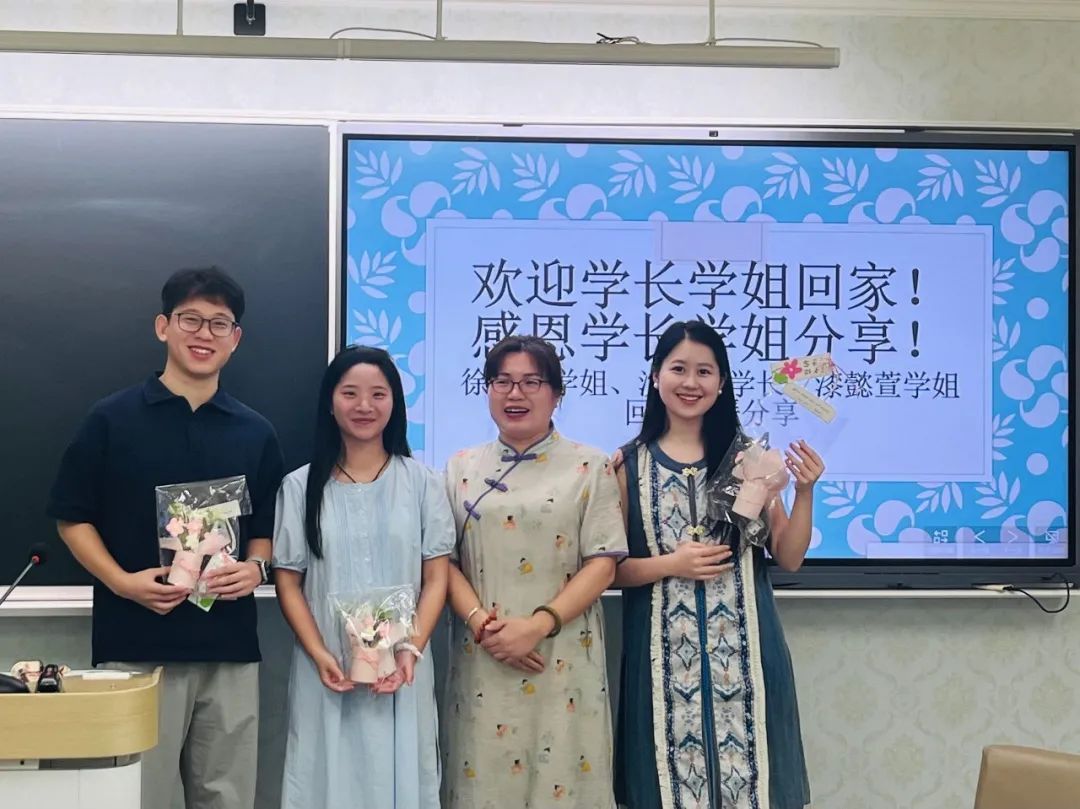 一群男人和女人站在墙边AI 生成的内容可能不正确。